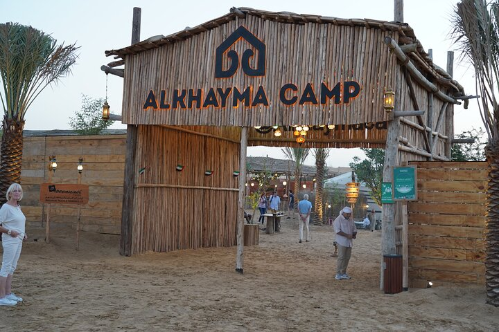 Immerse yourself in desert life at Al Khayma Camp where camel rides stargazing and a delicious BBQ dinner create unforgettable memories against a stunning sandy backdrop.